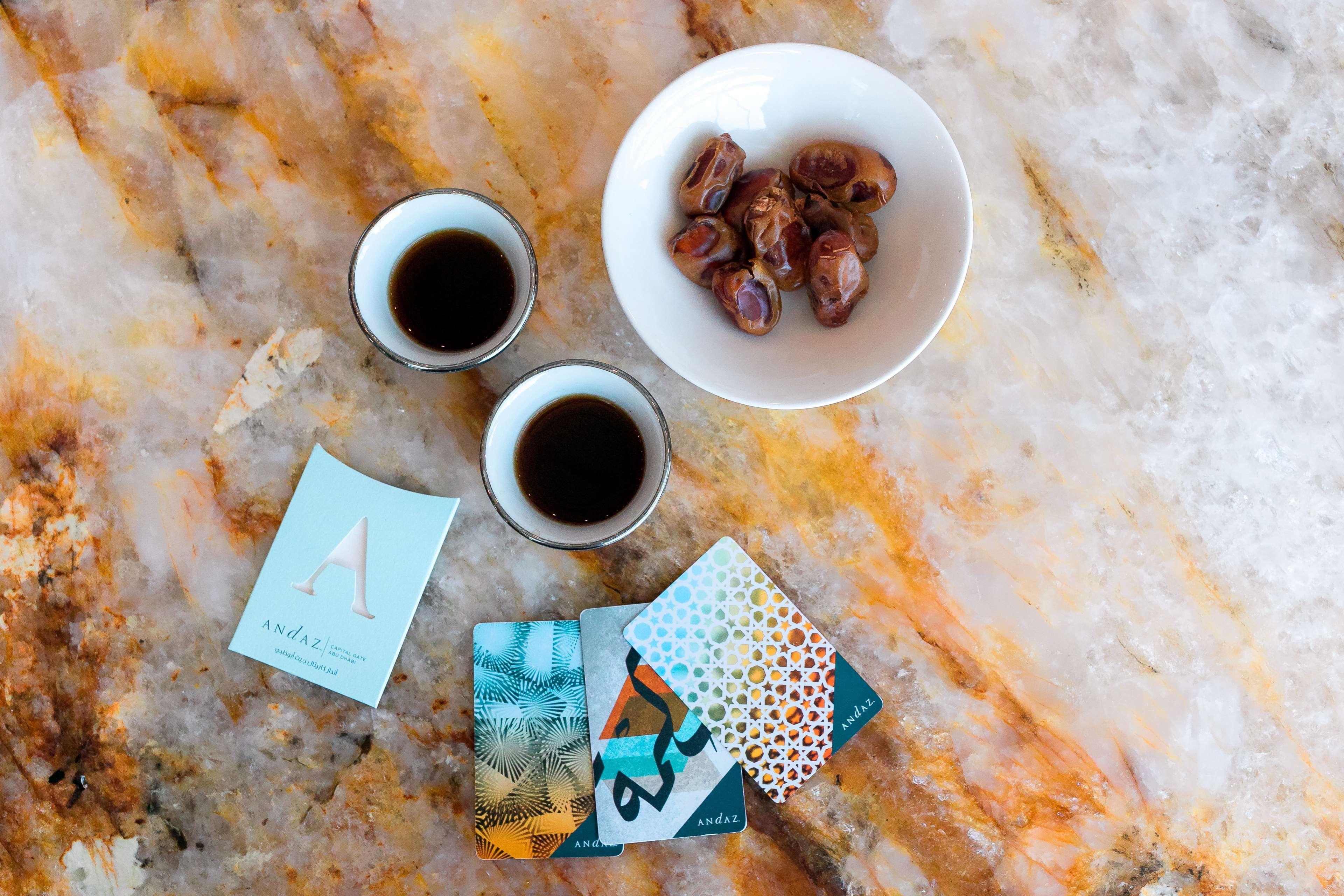 Andaz Capital Gate Abu Dhabi, By Hyatt Hotel Kültér fotó A cup of coffee with a bowl of dates